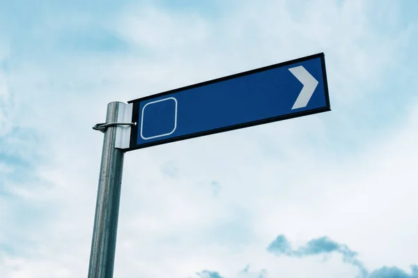 Mockup directional guide sign with arrow symbol pointing to the right, selective focus