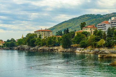 LOVRAN, CROATIA - September 7, 2022: Adriatic sea and Kvarner gulf coastline with town of Lovran distinctive architecture, famous travel destination in this part of Croatia
