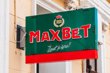 Zrenjanin, Serbia - April 29, 2023: Maxbet sign board. This is casino and betting, gambling and slot machine parlors company from Serbia clipart