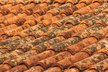 Old rustic terracotta roof tiles pattern as background, architectural detail from Lovran, Croatia