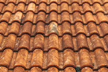 Old rustic terracotta roof tiles pattern as background, architectural detail from Lovran, Croatia