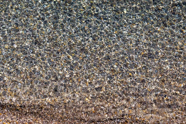 自然の背景として海の中の小石 トップビュー — ストック写真