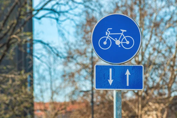 Two way bicycle lane traffic sign at the street, selective focus