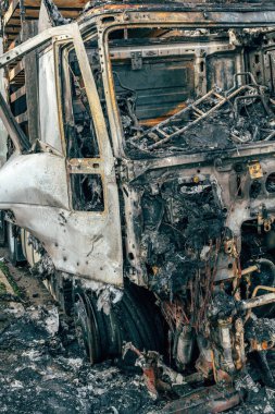 Semi truck engulfed by fire flames after traffic accident is burned and damaged, selective focus