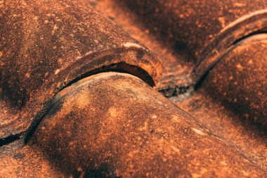 Closeup of old rustic terracotta roof tiles pattern as background, architectural detail from Lovran, Croatia