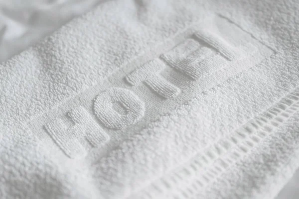 Luxury white bath cotton towel for hotel, selective focus