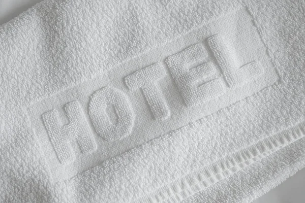 Luxury white bath cotton towel for hotel, selective focus
