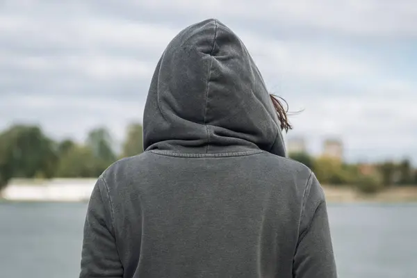 Rear View Woman Wearing Grey Hoodie Standing River Bank Cold — Stock Photo, Image
