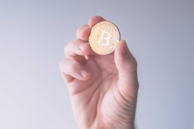 Bitcoin BTC sikke tutan kripto para tüccarı, seçici odaklı işletme finans ve ekonomi konsepti
