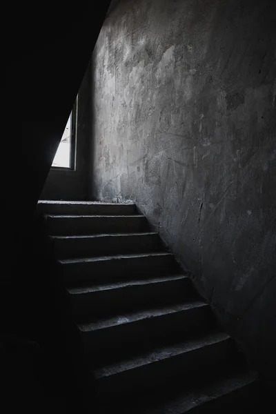 Unfinished concrete stairway steps in a building as grunge background