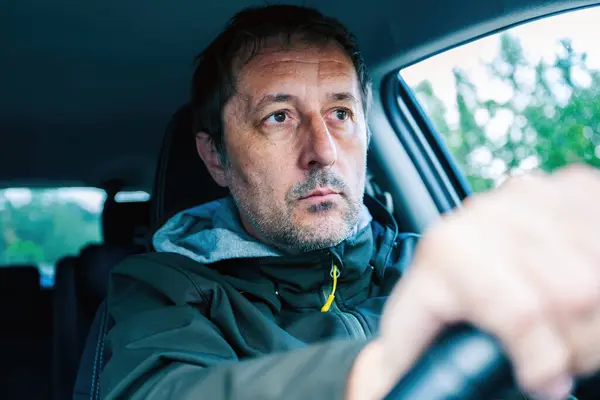 Closeup Portrait Cautious Male Driver Gripping Steering Wheel Driving Car Stock Image