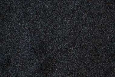 Haşhaş tohumu yığını, arka plan olarak Papaver somniferum 'un ham tohumlarının dokusu