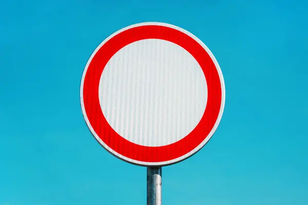 stock image No admittance road closed traffic sign against blue sky