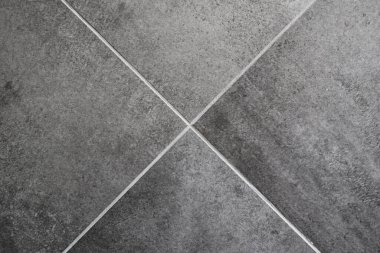 Arka plan olarak koyu gri seramik seramik döşeme dokusu, üst görünüm