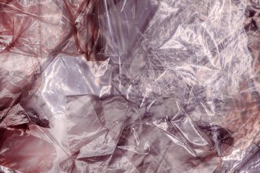 Parlak polietilen plastik kumaş dokusu yukarıdan buruşmuş ve kırışmış.