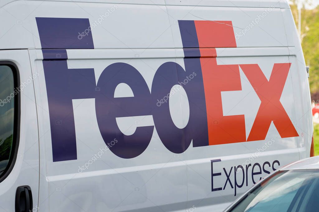 Novi Sad, Serbia - April 27, 2025: FedEx Express van on the street. An American multinational company specializing in transportation, e-commerce, and business services.