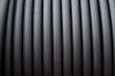 Arkaplan olarak su sulama için rulo siyah plastik tarım boru