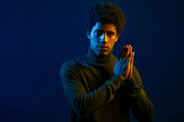 stock image Headshot of young serious man over dark studio background