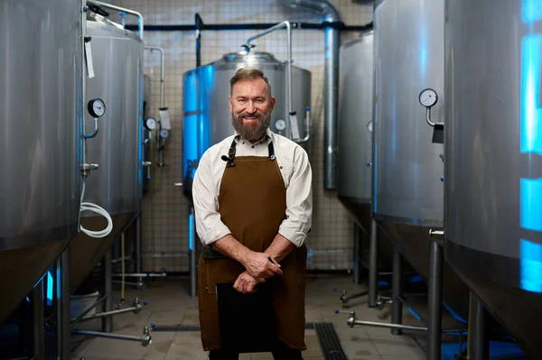 Portrait Smiling Brewer Man Apron Standing Distillery Vats Beer Manufacturing — Stok fotoğraf