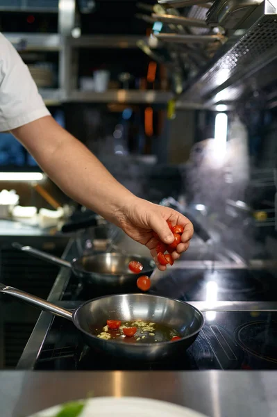 stock image Master chef preparing tomato sauce for pasta in frying pan. Cooking steps process on professional kitchen