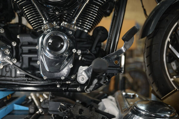 Closeup detailed shot of motorcycle clean and shiny gears and spare part. Motorbike construction system