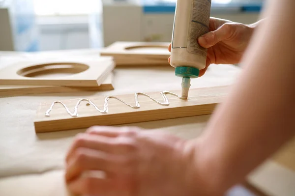 Man Carpenter Applying Glue Board Wooden Timbers Installing Closeup View — Stock Photo, Image
