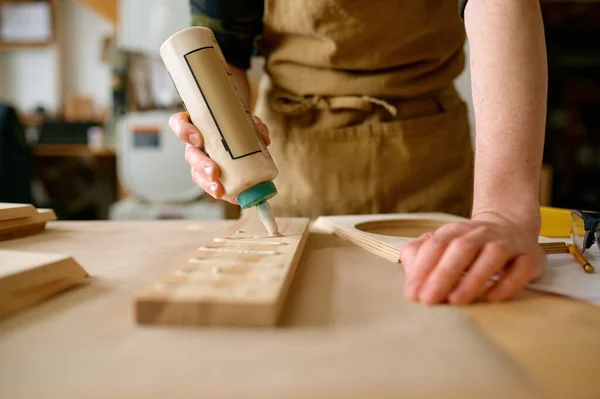 Man Carpenter Applying Glue Board Wooden Timbers Installing Closeup View — Stock Photo, Image