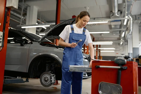 Young Woman Auto Mechanic Taking Instrument Work Toolkit Box Car — Stock Photo, Image