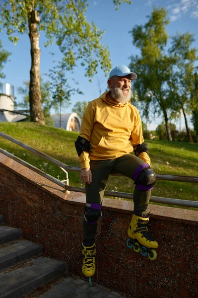 Happy Smiling Senior Man Wearing Roller Skates Rest Sitting Stair — Stock Photo, Image