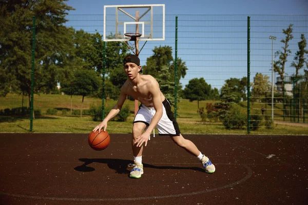 Active Teenager Basketball Player Practicing Ball Street Court Concentrated Boy — Stock Photo, Image