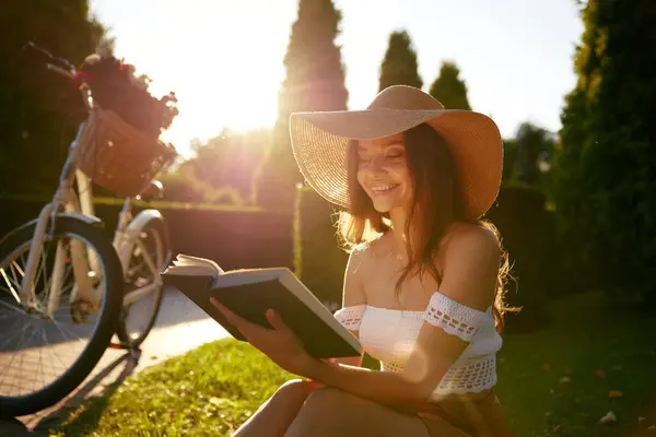 Charming Young Woman Reading Book While Sitting Park Bench Sunlight Stock Image