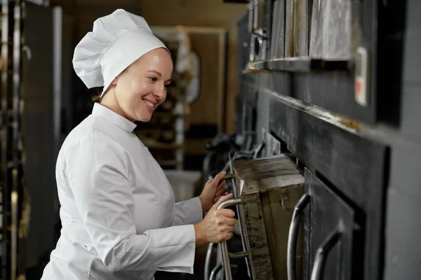 Woman Baker Uniform Opening Oven Stove Bakery Kitchen Commercial Bread — Stock Photo, Image