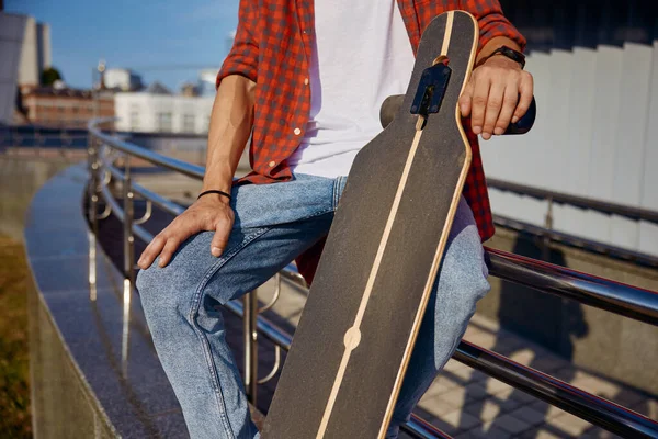 Closeup Man Holding Skateboard Hand While Sitting Steel Railing Sport — Stock Photo, Image