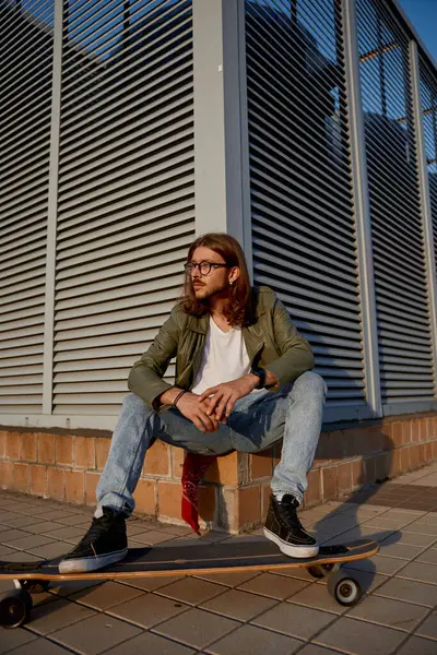 Young Urban Hipster Guy Wearing Casual Attire Sitting Skateboard City — Stock Photo, Image