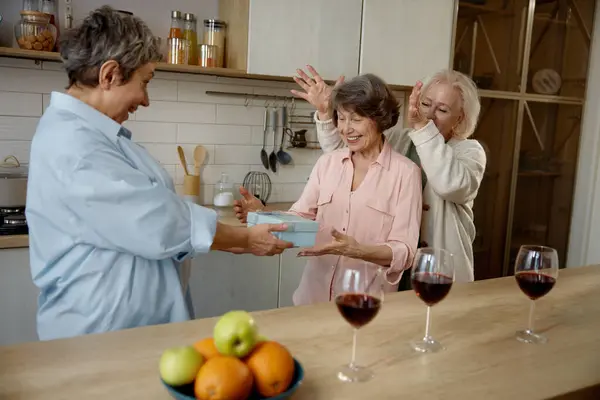Happy Elderly Ladies Celebrating Birthday Home Kitchen Three Retired Senior stockbilde