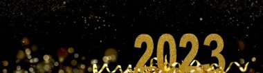 2023 Yeni Yıl Soyut bir gecede kurdele ve parıltı içinde