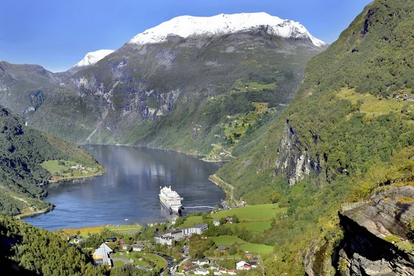 stock image view on beautiful  geirangerfjord in Norway with the village and tourism boat 