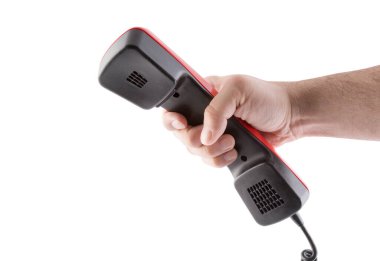 Siyah retro telefon alıcısına sahip el kırpma yolu ile beyaz arkaplanda izole