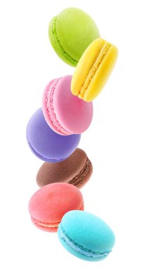 Levitating macaroons of different colors isolated on white background