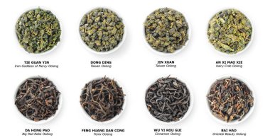 Çin Oolong çayı koleksiyonu, kâselerde gevşek kuru yapraklar, beyaz üzerinde izole üst manzara.