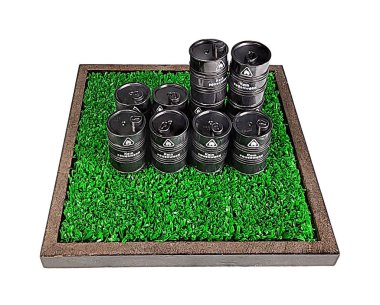 Black steel drums of caustic materials on a patch of grass clipart