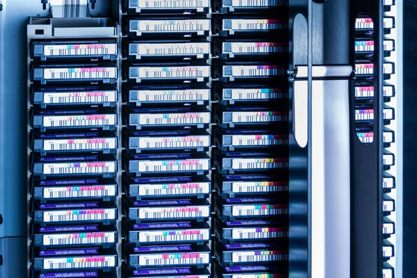 tall stacks of data backup tapes in internet cloud center