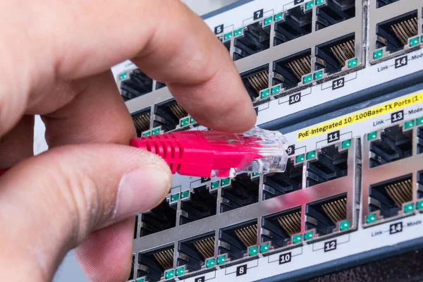 Hand Administrator Plugging Red Patch Cable Empty Switchboard — Stock Photo, Image