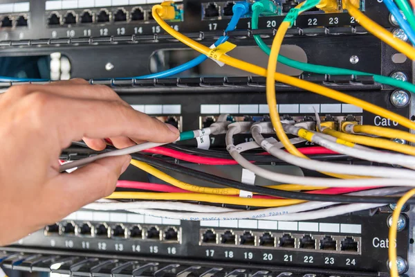 Closeup Hand Administrator Connecting Network Cable Switch — Stock Photo, Image