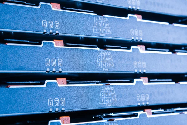 detail of data storage hardware inside data center - cluster of hard drives inside server rack