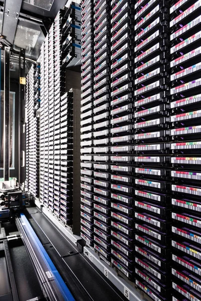 rows of data cloud hardware inside data center
