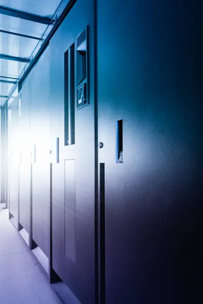 stock image row of server cabinets inside data center room