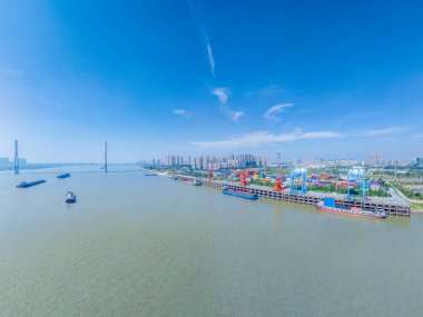 aerial view of Anqing port with cityscape by Yangtze river,Anqing city, Anhui province, China clipart