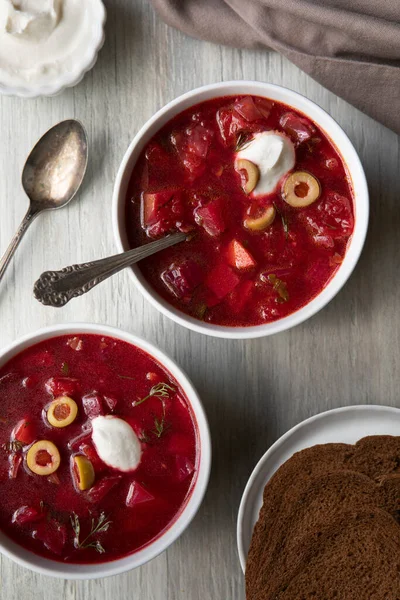 Two Bowls Chunky Borscht Soup Topped Green Olives Sour Cream Royalty Free Stock Photos