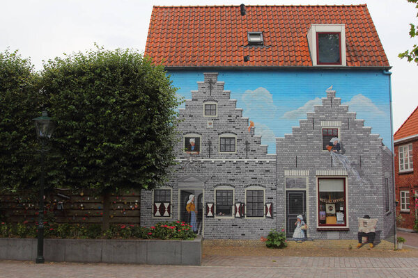 a beautiful graffiti / wall painting of a medieval house in Zierikzee (Zeeland), the Netherland